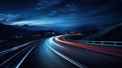 Cars light up trails at night on a curved paved road at night. - obrazy, fototapety, plakaty