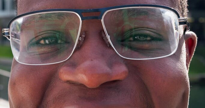 Closeup, eyes and man with glasses, face and optometry with clear vision, retina and frames. Portrait, zoom or person with eyewear, looking or see with wellness, sight or human with health or optical