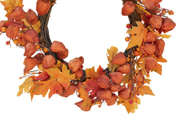 autumn wreath of artificial red leaves and autumn fruits. Isolate on white.