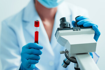 Close up dedicated hematology lab technician scrutinizing blood sample analysis under microscope,...
