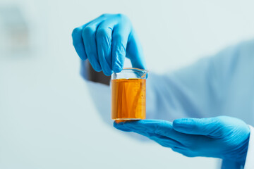 Close-up of laboratory technician conducting rigorous oil test, ensuring product integrity and...