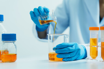 Close-up of laboratory technician conducting rigorous oil test, ensuring product integrity and...
