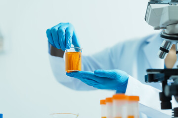 Close-up of laboratory technician conducting rigorous oil test, ensuring product integrity and safety, oil sample for quality control and purity testing, advancing petrochemical knowledge
