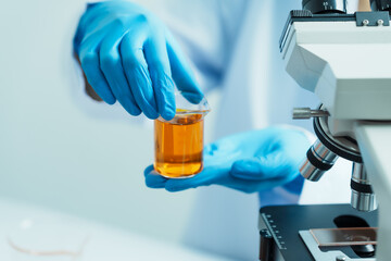 Close-up of laboratory technician conducting rigorous oil test, ensuring product integrity and safety, oil sample for quality control and purity testing, advancing petrochemical knowledge