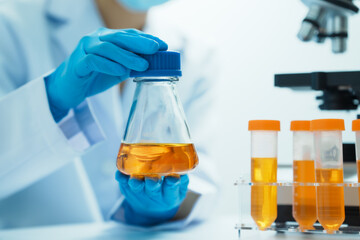 Close-up of laboratory technician conducting rigorous oil test, ensuring product integrity and...