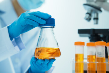 Close-up of laboratory technician conducting rigorous oil test, ensuring product integrity and...