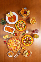 Cheese pizza on wooden table, dark interior background, period wooden furniture, retro style
