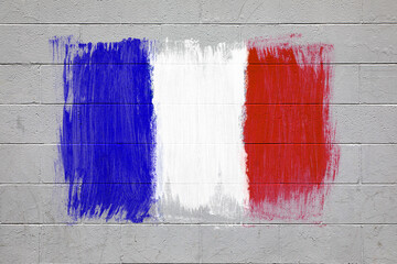 France flag colors painted on brick wall