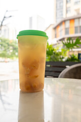 cup of chinese wampi with sea salt ice tea vertical composition