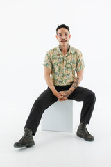 Isolated cutout studio shot Asian vintage classic male fashion model with mustache neck arm tattoo...