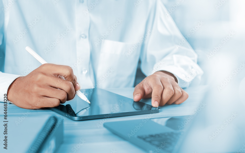 Poster working concept. businessman working with tablet and laptop computer on table in office.
