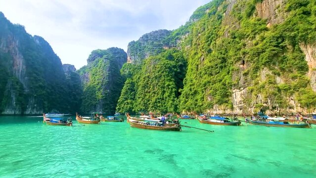 Longtail boats at Pileh Lagoon with the green emerald ocean at Koh Phi Phi Thailand , during a boat trip to Maya Bay Koh Phi Phi Island