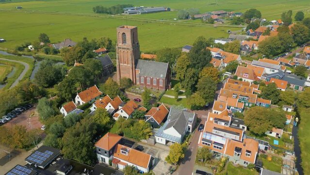 Backward travel above traditional Dutch village Ransdorp and it's spireless church