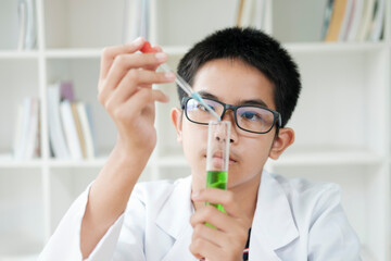 Young Scientists in Action: Kids Conduct Chemistry Experiment in School Laboratory