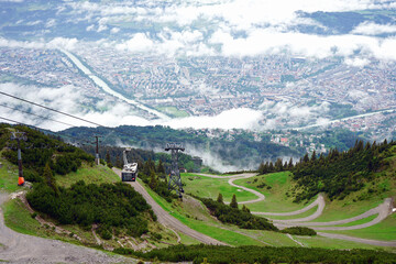 Gondola up and down To see the mountain peaks and ski of Innsbruck, Austria. © Pond Thananat