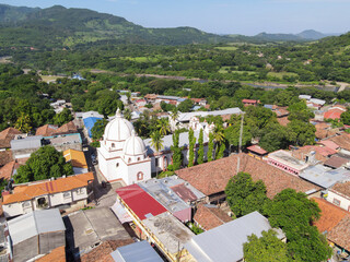 An aerial photo over an antique church that has three domes and is the second oldest of its kind in Latinamerica