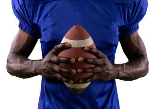 Digital png photo of african american man holding american football ball on transparent background
