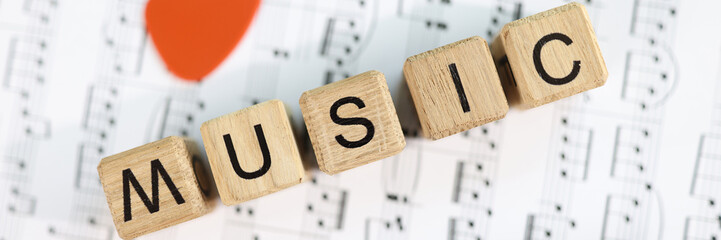 Music word collected from wooden cubes and musical notes