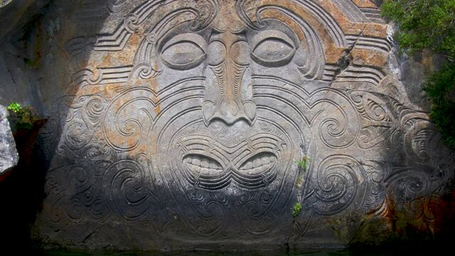 New Zealand Maori Stone Carvings At Taupo Lake. Slow Zoom In On Face.