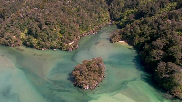 Abel Tasman National Park In New Zealand; Aerial Flyover Over The Shallow Estuaries Of Awaroa Beach During Low Tide.