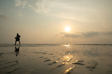 Fototapeta premium sunset in the seashore of Bakkhali. Beautiful beach landscape. Dreamy sunset sky calm tranquil relax sunset summer mood. 03.28.2023. Bakkhali, South 24 Parganas, West bengal, India.