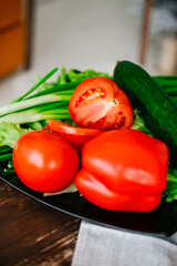 The concept of healthy eating, diet. Vegetables. Greens. Peppers, tomatoes, cucumbers.