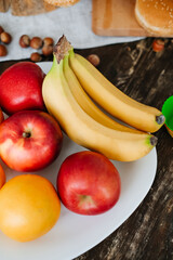The concept of healthy eating, diet. Fruit. Bread. Apples, bananas, oranges.