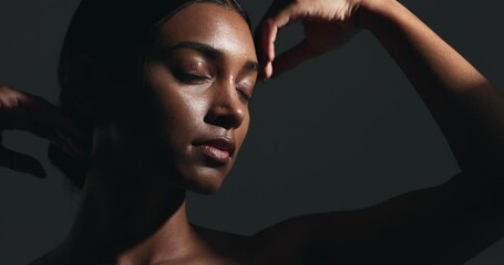 Beauty, sensual and young woman in a studio with body care, wellness and health routine. Cosmetic, movement and portrait of an Indian female model with glowing skin treatment by a black background. - Powered by Adobe