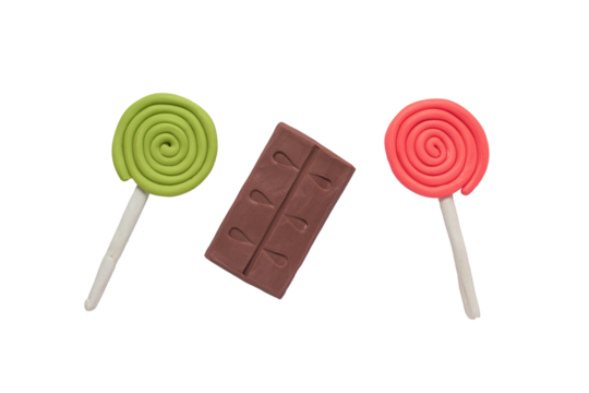 Candy lollipops and chocolate bar to decorate handmade with plasticine, party birthday concept
