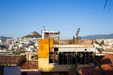 Old ruined building in top of Plaka district as seen in Athens skyline