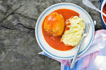 Stuffed peppers in tomato sauce - 644726068
