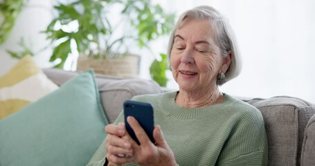 Senior woman, sofa and video call on smartphone, social network and mobile contact at home. Happy elderly lady talking on cellphone with voip communication, digital app or virtual chat in living room - Powered by Adobe