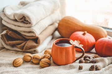 Cup of hot tea and a leaf, autumn mood