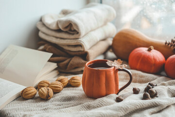 Cup of hot tea and a leaf, autumn mood