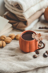Cup of hot tea and a leaf, autumn mood