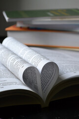 a heart made of leaves in a book