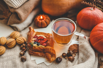 Sweet pastry and cup of tea, good autumn morning concept