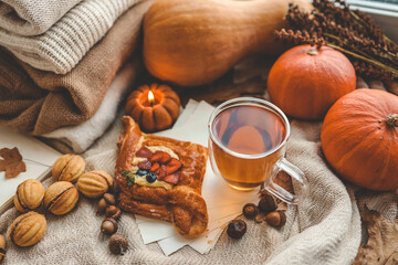 Sweet pastry and cup of tea, good autumn morning concept