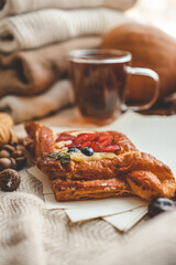 Sweet pastry and cup of tea, good autumn morning concept