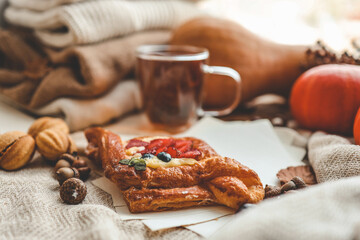 Sweet pastry and cup of tea, good autumn morning concept
