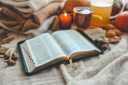 Open bible in autumn interior, good morning