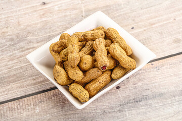 Raw ripe unpeeled peanut heap