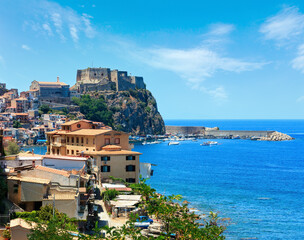 Summer Tyrrhenian Sea coast and beautiful Scilla town view, Calabria, Italy. People unrecognizable.