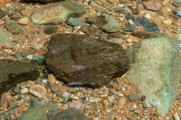 Stones under clear water, after some edits.