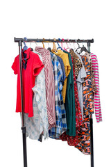 Various second-hand clothes from the wardrobe on the rack - 644742239