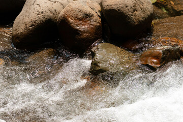 Water flowing over rocks in a stream, after some edits.