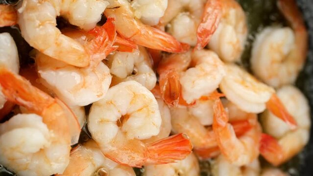 Cooking fry shrimps in pan. Vertical video
