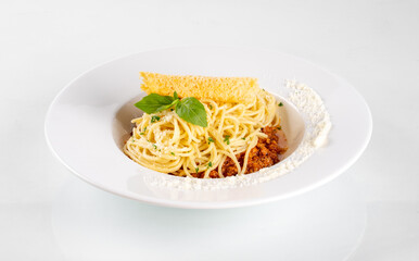 Spaghetti in a dish on a white background from Italy pasta lunch with tomato sauce

