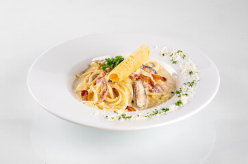 Spaghetti in a dish on a white background from Italy pasta lunch with tomato sauce


