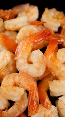 Fresh shrimps fried in oil pan, close up